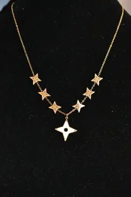 Collier shuriken étoile Or