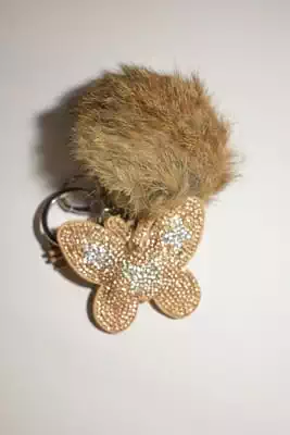 pompon papillon multicolore