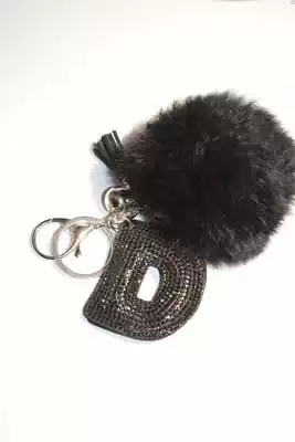 pompon lettre D multicolore