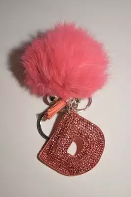 pompon lettre D multicolore